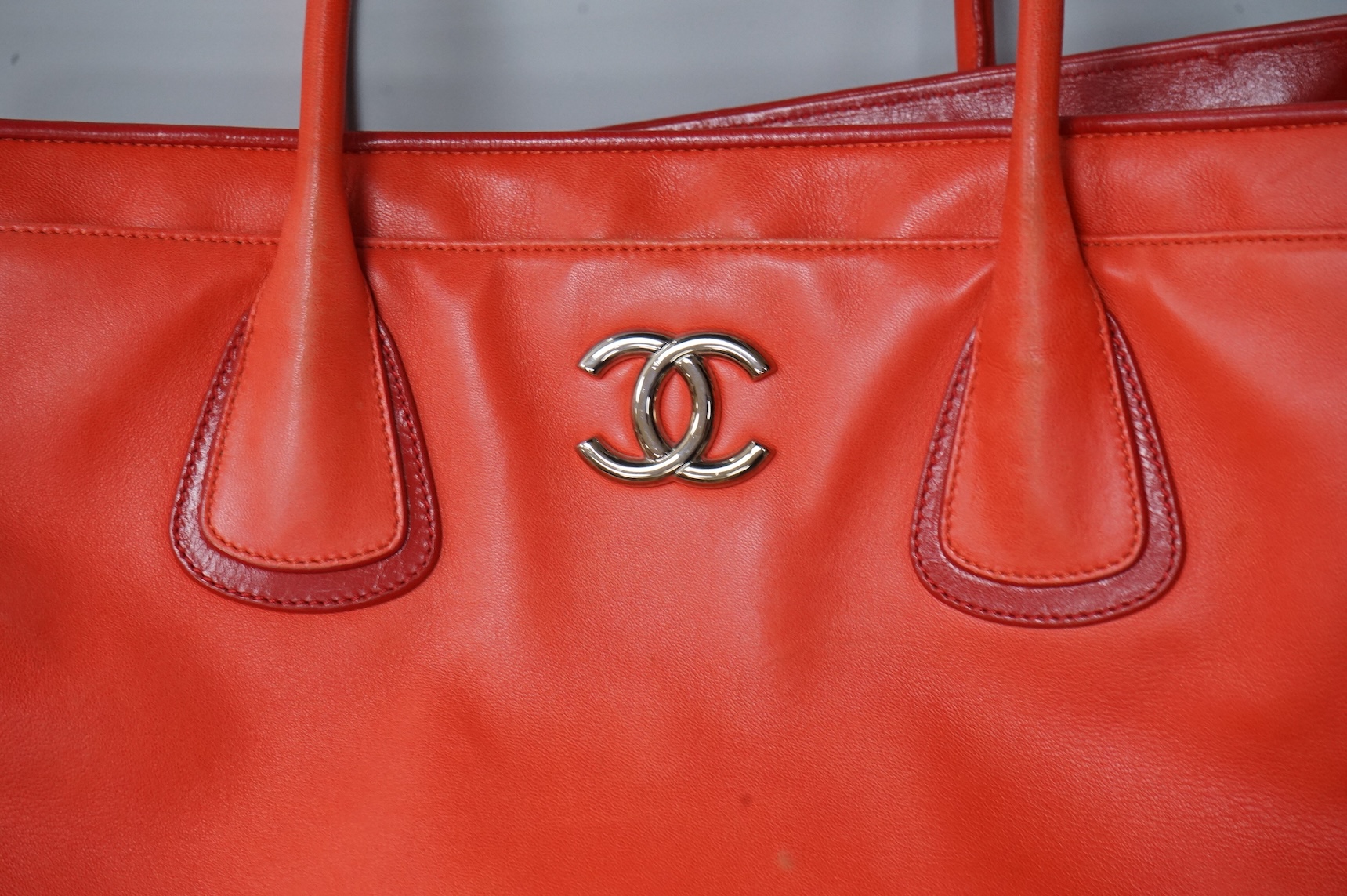 A Chanel red leather Executive Cerf tote bag with silver hardware, with original receipt and dust cover, 41cm wide, Provenance: Purchased by the vendor in Dubai, Chanel